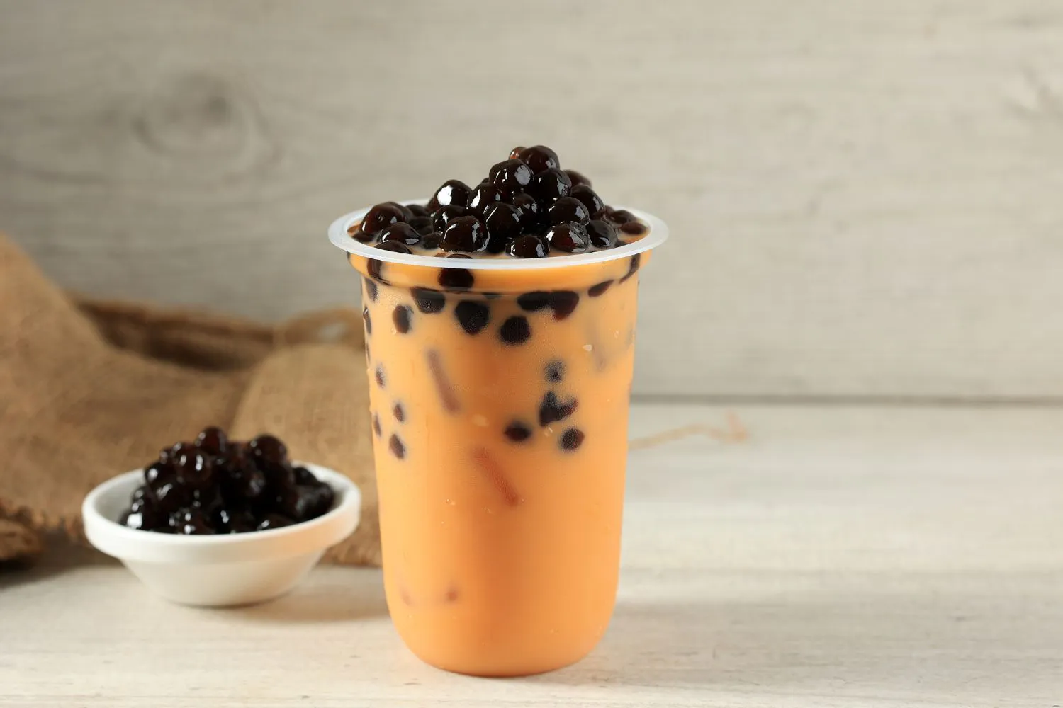 Thai iced tea overflowing with chewy tapioca pearls at Tangscape, a Cafe in Forest Hills